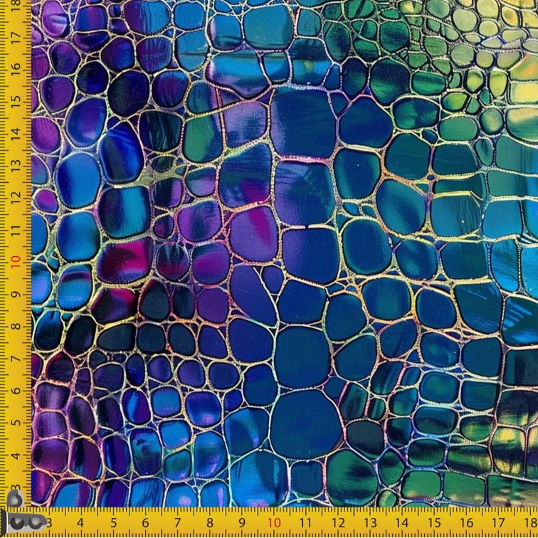 Colorful fabric with croc scales pattern and a ruler for scale.