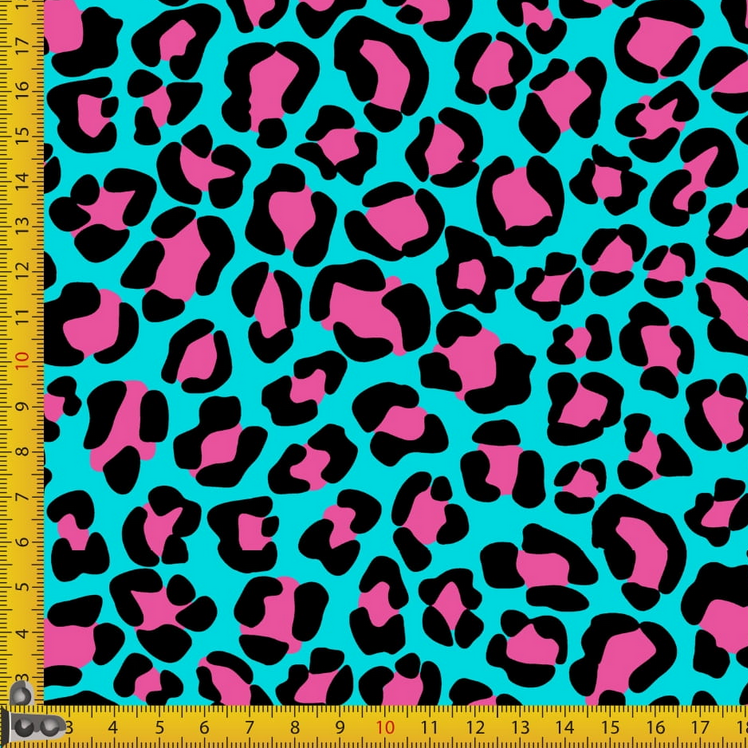 Leopard print fabric with pink and black spots on a blue background, measured by a ruler.